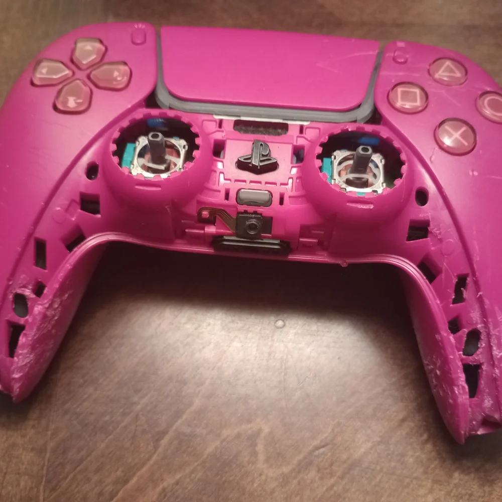 Gray and Pink Video Game Controllers